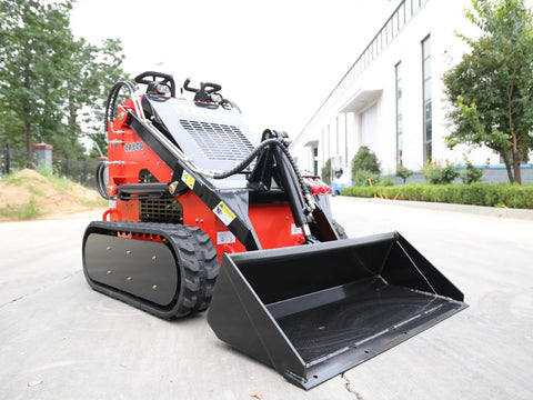 Stomp Mini Skid Steer Loader with 1800 lb Capacity and Lawn Scarifier Attachment for Small Jobs in outdoor setting