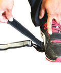 Person adjusting Golf Leg Power Correction Strap on shoe for powerful smooth swing training.