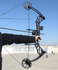 Drop Away Arrow Rest For Right Hand Compound Bow With Cable Activated Full Containment in use during outdoor archery practice