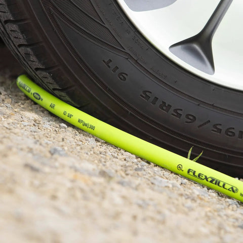 Beefy Three Eighths Inch Hybrid Air Hose 250 Feet Lightweight Yet Heavy Duty Kink Resistant under car tire on gravel