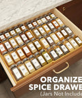 No Sweat Adjustable Bamboo Spice Drawer Organizer Expands To Fit Any Kitchen Cabinet Slot with organized jars in drawer.