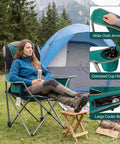 Person relaxing in Two Pack Oversized Camping Chair Set With 3 Level Adjustable Back Ergonomic Lounge, showing cup holders and cooler bag.