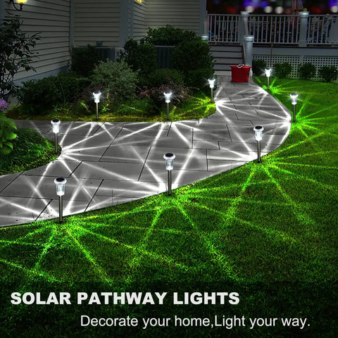 Solar Pathway Lights Outdoor IP65 Waterproof Stainless Steel Landscape Lighting for Yard Patio Lawn Walkway Garden Cool White LED All Weather Durable Construction Easy Install Low Maintenance 6 Pack illuminating a curved garden path at night.