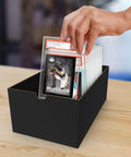 Hand placing trading card in PSA Logo Slab Sleeves Pack Of 50 With Resealable Design For Graded Baseball Football Gaming Trading Cards Precise Fit Slab Protectors For PSA Graded Cards Perfect For Display And No Fuss Storage