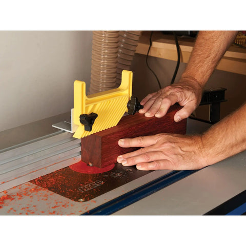 Keep Your Feed Locked Down Rock Solid Vertical Feather Board For Router Tables And Table Saws T Track Compatible adjustable polymer fence in use on wood.