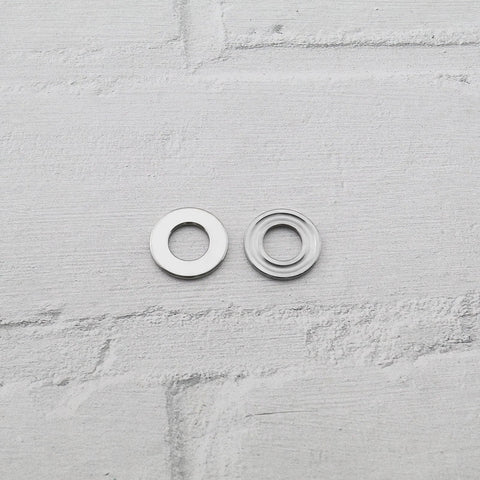 Close-up of two chrome steel thrust ball bearings, 8x16x5mm, single-direction miniature bearings.