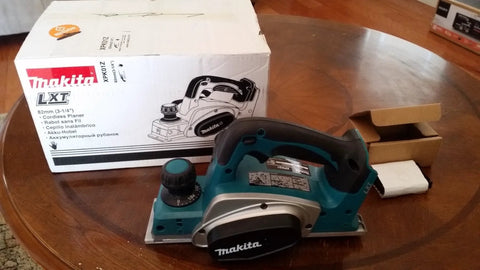 Makita XPK01Z cordless planer, 18V LXT, front view with teal housing.