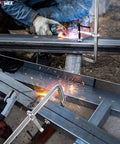 Heavy Duty F Clamp Set, 16 Inch Opening, 4.75 Inch Throat Depth in use during metal welding fabrication, sparks visible