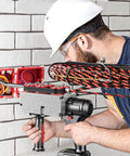 Professional Cordless Fish Tape For Electricians With 21V Brushless Motor used by an electrician handling wires in a wall.