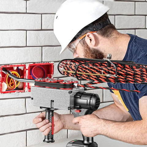 Professional Cordless Fish Tape For Electricians With 21V Brushless Motor used by an electrician handling wires in a wall.