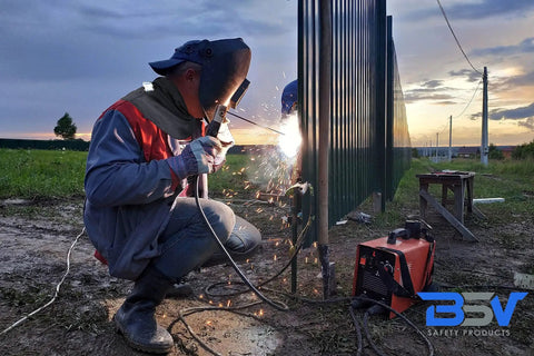 Genuine Kevlar Welding Neck Guard Built Tough As Nails For Daily Job Site Grind Cut Heat And Flame Resistant Armor worn by a welder.