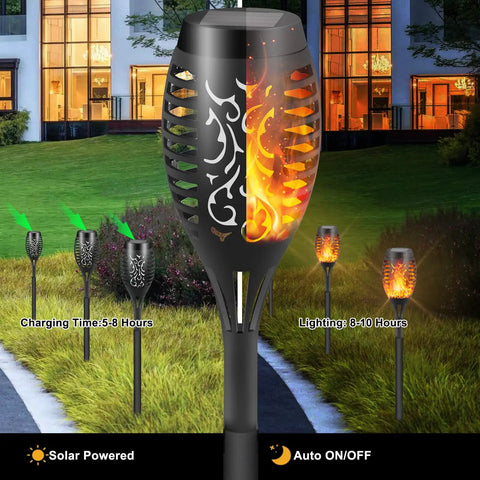 Solar Torch Lights With A Lit Flickering Flame Effect Outdoor Pathway Lights IP65 Waterproof in garden setting at night