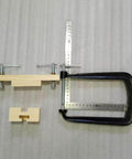 Classical Guitar Bridge Clamp For Quick Maintenance And Bridge Repair with wooden accessories and metal fixture