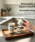 Stacked Ceramic Demitasse Espresso Cups Set Of 2, 3.52 Oz Handleless Demitasse Mugs displayed on wooden tray in modern kitchen.