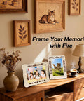 Wall with wood-burned art, cat and leaf designs, framed photos; a display showcasing All In One Wood Burning Kit With Adjustable Temperature Pen 81 Piece Pyrography Set For Wood Leather Foam And Fabric Includes 14 Tips And Case Ideal Gift For Adults And Teens Beginner Friendly.