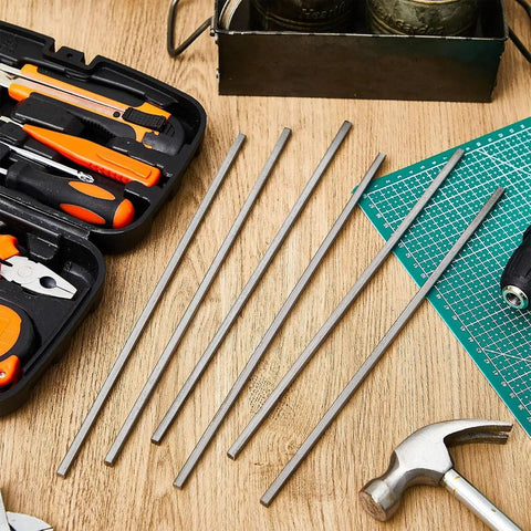 Image of 12 Piece Square Steel Bar Stock Set One Quarter Inch By One Quarter Inch By Twelve Inch Cold Drawn Metal Bars For DIY Projects Fabrication And Industrial Use Heavy Duty High Precision Durable And Ready For Machining on a wooden table with tools.