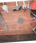 Built Tough Manganese Steel Wedge Locking Washers on a workbench next to tools and safety glasses, ideal for machinery.