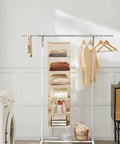 Six Tier Hanging Closet Organizer Shelf With Cloth Fabric And Two Sturdy Hooks Foldable Beige Storage Solution displayed with clothes