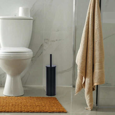 Heavy Duty Toilet Plunger With Sleek Floor Holder Kick Serious Bathroom Grime Monster Suction Unblocks Clogged Drains Real Quick Matte Black Sturdy Grip next to toilet.