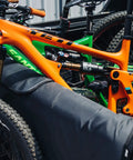 Two mountain bikes with Neoprene Bike Pedal Covers for Transport and Storage, 3mm Thick Cushioned Protection, loaded in truck.