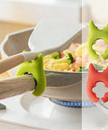 Cooking with red and green silicone spoon rests set for ladles, tongs, spatulas, heat resistant utensil holder on pot handle.