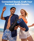 People on a beach holding Roar 3 Bass-Boosted Portable Bluetooth Speaker With 20W Thumpin Bass, RGB Lights, Waterproof, Bluetooth 5.4.