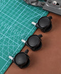 Four Pack One Inch Swivel Caster Wheels With Locking Brakes For Smooth Rolling Furniture Replacement on a cutting mat.