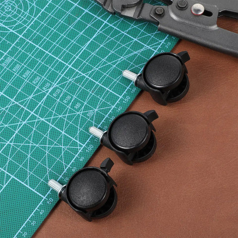 Four Pack One Inch Swivel Caster Wheels With Locking Brakes For Smooth Rolling Furniture Replacement on a cutting mat.