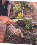 Gardener using Ergonomic Wooden Handle Weed Puller Tool For Gardeners Lightweight Weeding Tool For Dandelions And Weeds Easy Grip Back Saving Garden Hand Tool For Home Yards Yard Work Buddy in flower bed.