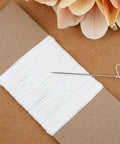 Linen Thread For Bookbinding And Sewing Signatures, Archival Quality, Unwaxed And Unbleached White, 50 Yards, 35 By 3 Gauge shown with needle