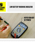 500 Volt Digital Multimeter With Backlit LCD Display for AC and DC voltage testing, showing low battery warning indicator in use