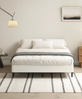 Badass Durability Seven Inch Queen Box Spring With Heavy Duty Steel Frame And Tear Resistant Fabric Cover in a stylish bedroom setup.