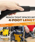 Flexible One And A Quarter Inch Diameter Four Foot Vacuum Hose Replacement For Wet And Dry Vacuums in use, black vinyl.