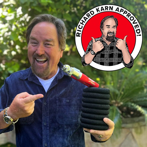Pocket Hose 50 ft expandable garden hose with Turbo Shot nozzle; black coil and red nozzle visible