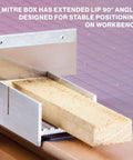 Front view of a metal mitre box with a 6-inch wood block; aluminum and steel construction for 45° and 90° cuts