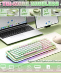 Butter Smooth Milk Switch Wireless Mechanical Keyboard With 98 Key Layout And Full Number Pad Featuring Totally Fire Cake Theme Vibe And Vibrant Dye Sub Keycaps on a workspace next to a laptop.