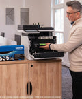 Person installing toner in Color Laser All In One Printer With Duplex Printing, Scan And Copy, Fast 33 Pages Per Minute, Budget Friendly