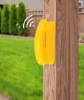 Yellow telephone attachment on a wooden swing set post, part of kids outdoor playground accessories swingset attachments set.