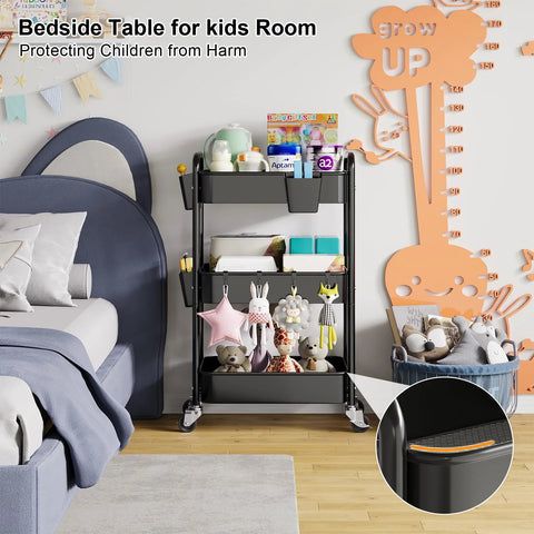 Three Tier Metal Rolling Cart On Wheels In Black in kids room next to bed, used as bedside table, holding toys and books.