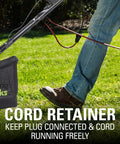Person using 13 Amp 14 Inch Corded Dethatcher And Scarifier For Lawn Care 3200 RPM No Load Speed 2 In 1 Design with cord retainer feature