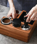 Heavy Duty Solid Walnut Espresso Tamper Station With Integrated Knock Box And Filter Cup Non Slip Base Straight Up Barista Gear in use.