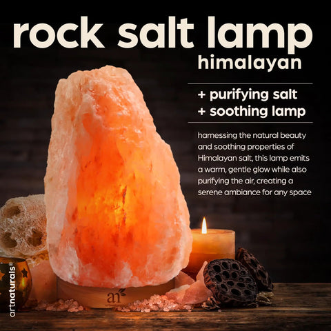 Himalayan Pink Salt Lamp With Real Wood Base Natural Glow Night Light For Relaxation And Energy next to candle