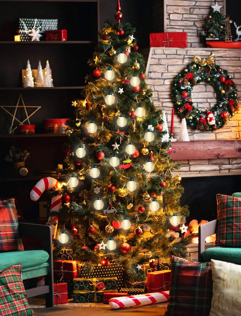 Decorated Christmas tree with Cozy Up Your Patio With 25 Ft Outdoor Globe String Lights 27 Clear G40 Bulbs Plus 2 Spares Perfect For Patio Backyard Cafe Or Indoor Living Room Decor White Wire UL Listed glowing warmly indoors with gifts underneath.