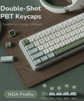 Gasket Mount 60 Percent Wired Mechanical Keyboard Hits Different With Hot Swap Linear Switches Smooth Pbt Keycaps And Rgb Backlight And Programmable Knob For Your Desk showcasing double-shot PBT keycaps in green and white.
