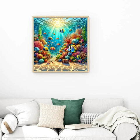 Ocean View 5D DIY Diamond Painting Kit For Adults And Newbies, vibrant underwater coral reef art on wall above a couch.
