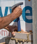 Worker using 20 Oz Masonry Hammer With Forged Steel Construction And Shock Reduction Grip Pro Grade Workhorse Bricklaying Tool