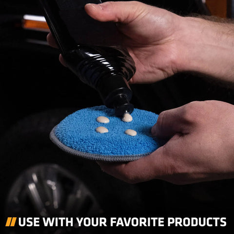 Applying wax to blue microfiber pad from Four Pack Five Inch Blue And Gray Microfiber Polishing Pads For Car Detailing