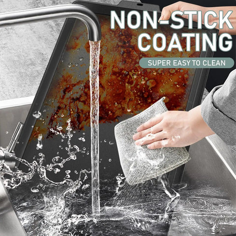 Washing a 23x16 inch cast iron griddle with nonstick coating under running tap, showing easy cleaning for gas grill and stovetop use.