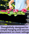 Top Shelf 16 Inch Black Metal Railing Planters Two Pack Rectangular Hanging Flower Boxes on railing with flowers.