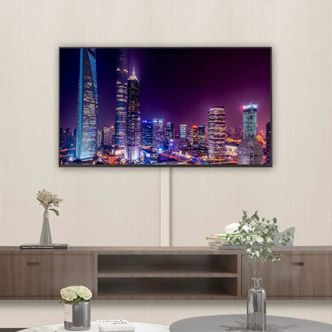 Wall Cord Cover Kit For TV Setup, 32 Inch Long Paintable Cable Concealer hides wires on wall beneath mounted TV in living room.